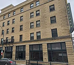 Charming historic building with elegant brick facade, offering modern urban living.