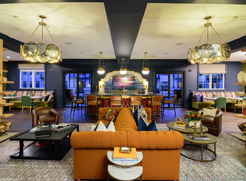 Luxurious modern lounge with elegant lighting, plush seating, and a stylish bar area for ultimate relaxation and social gatherings.