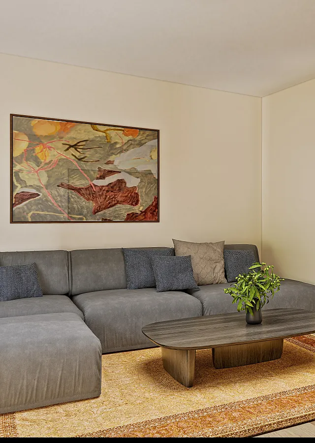 Modern apartment living space with elegant decor, featuring a stylish gray sofa, vibrant artwork, and a cozy bedroom nook.