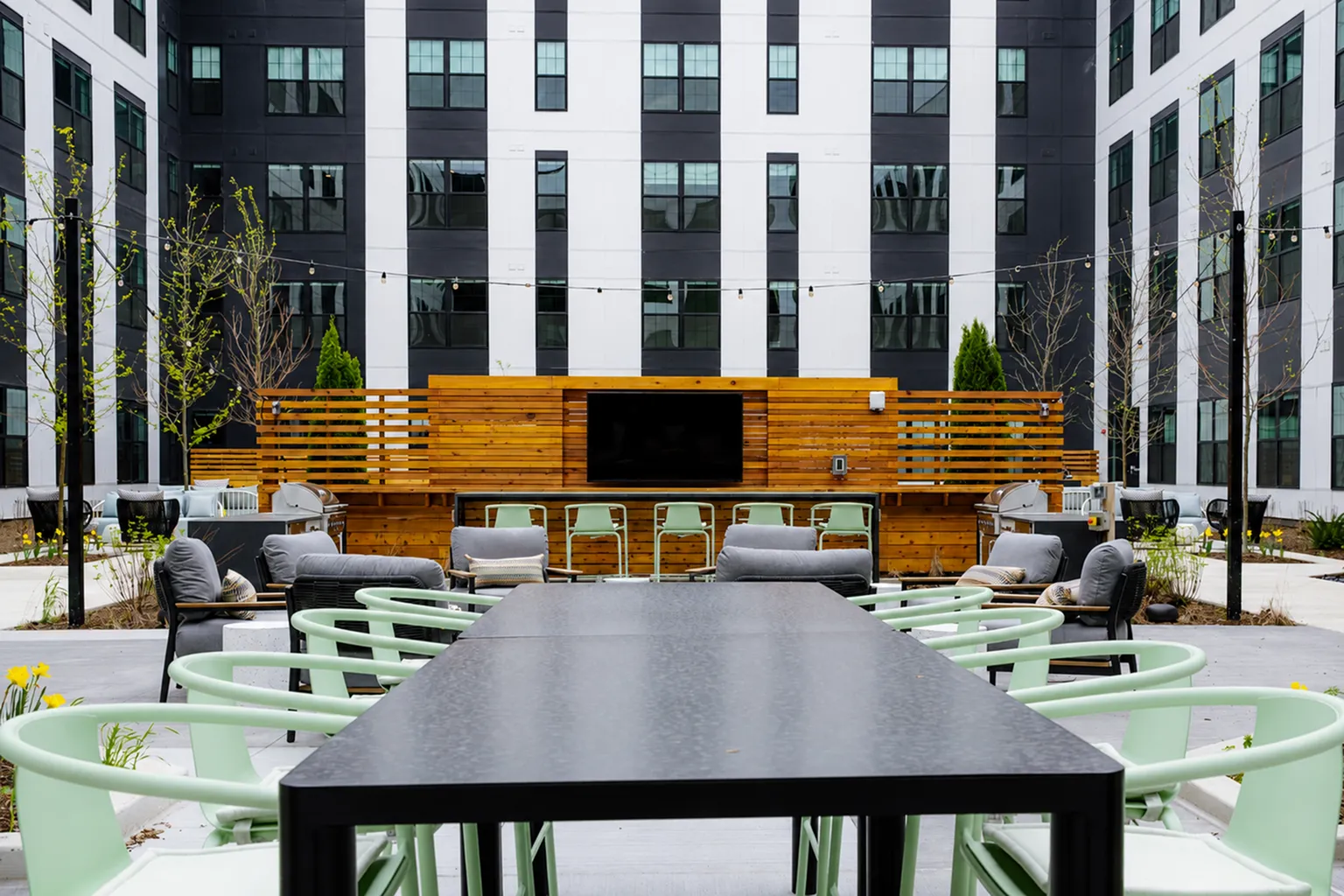 The Elex coutyard with large outdoor TV