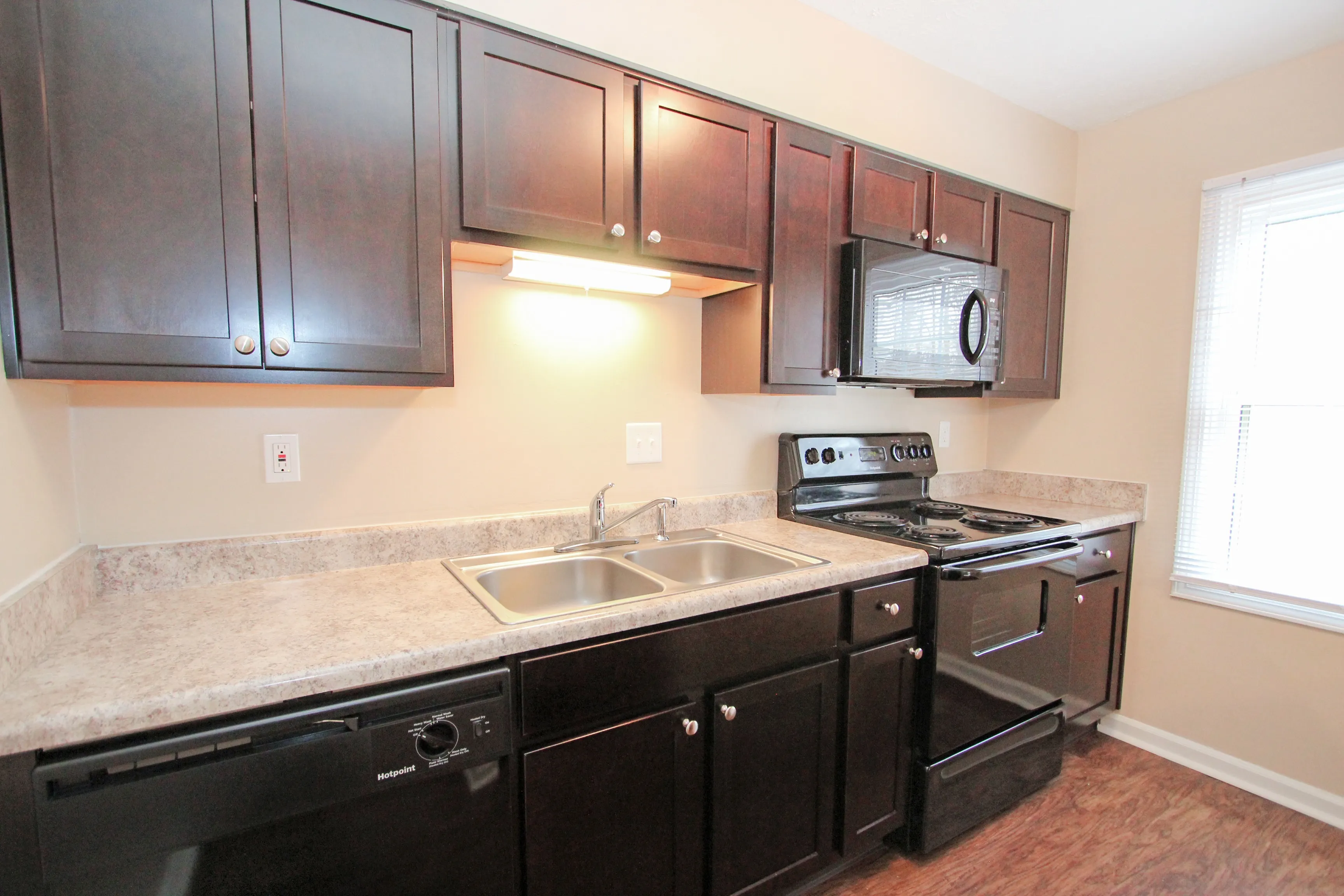 Jamestown Village Kitchen with Black appliances