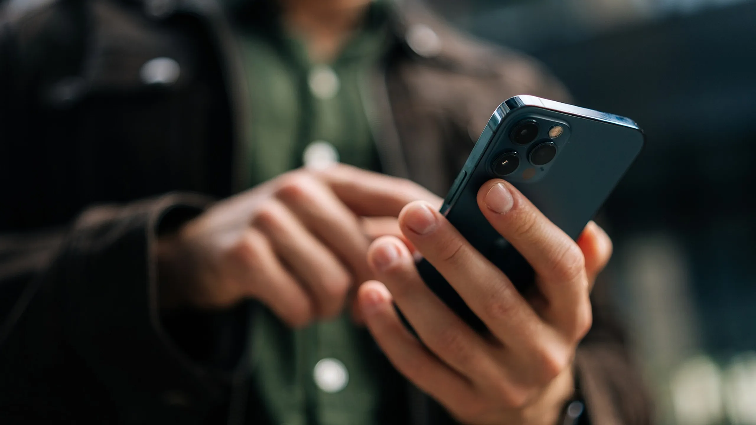 Close-up of a person using a smartphone, showcasing sleek design and modern technology.