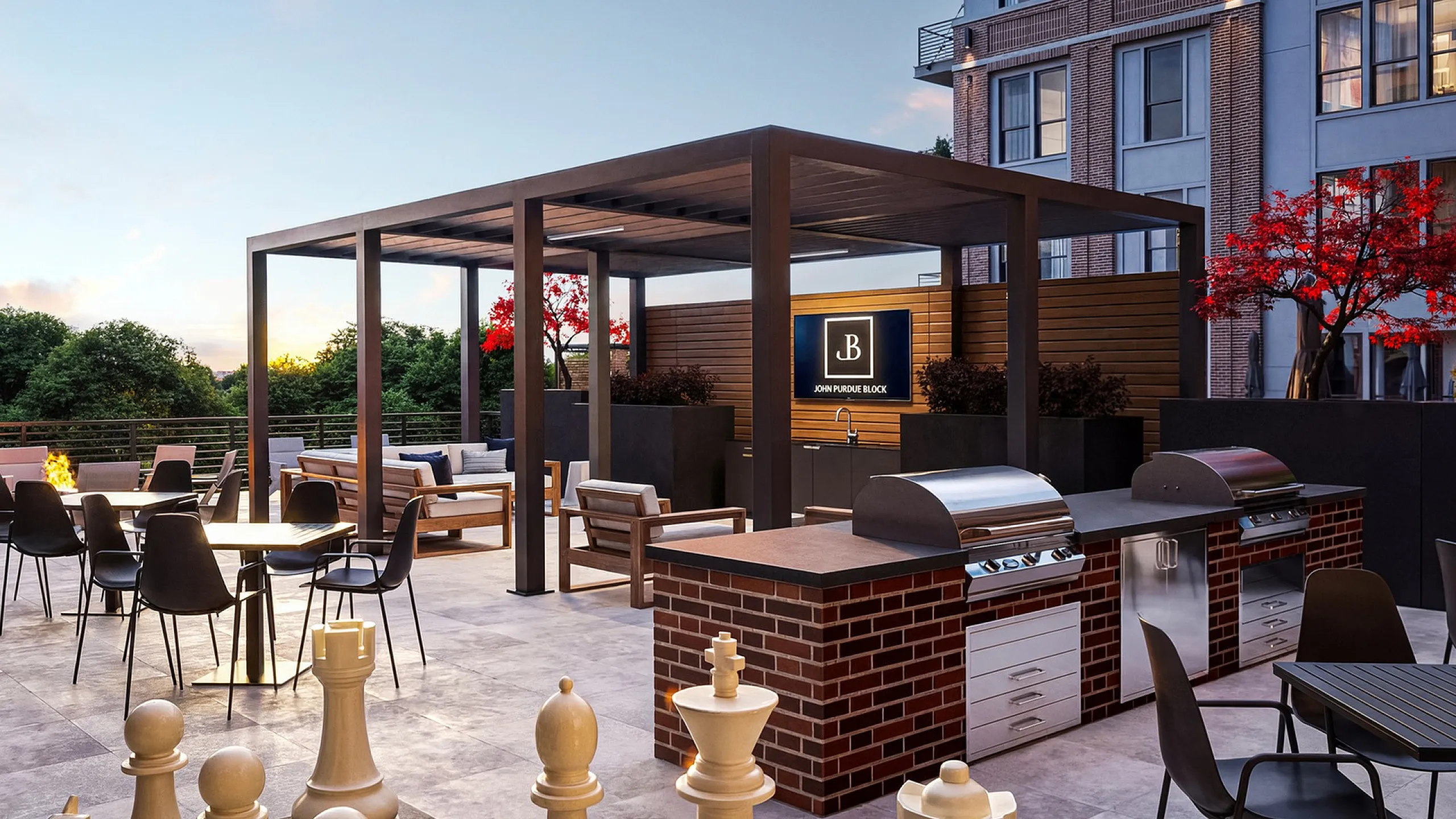 Luxurious rooftop patio featuring modern grills, stylish seating, and vibrant landscaping, perfect for entertaining and relaxation.