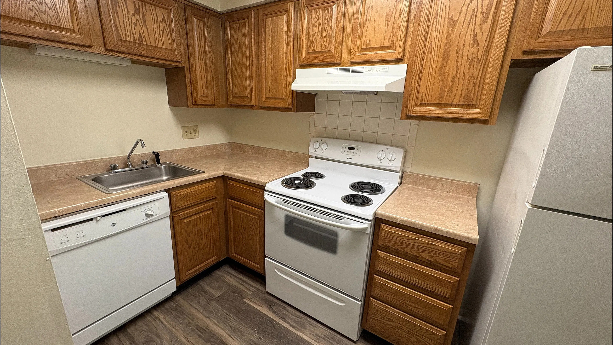 Cozy kitchen with warm wooden cabinets | Braeburn Village
