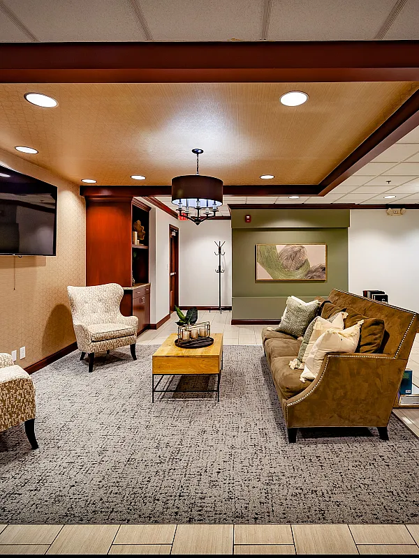 Elegant lounge area featuring plush seating, modern lighting, and sophisticated decor creating a cozy ambiance.