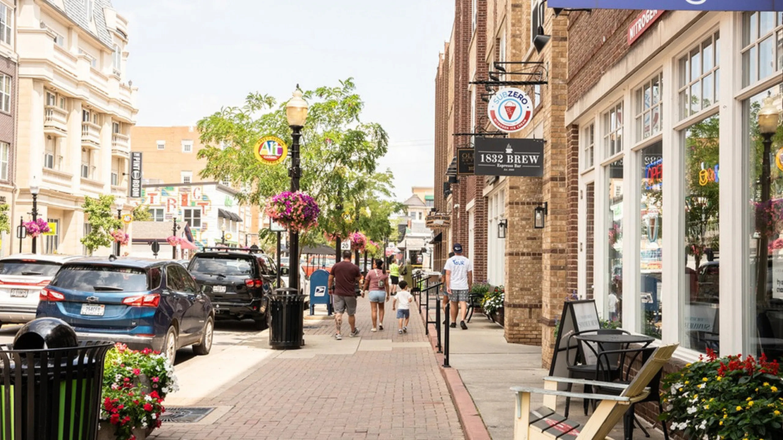 Old Town on the Monon Charming urban streetscape with vibrant shops, cozy cafes, and inviting sidewalk seating, perfect for leisurely strolls and community ambiance.