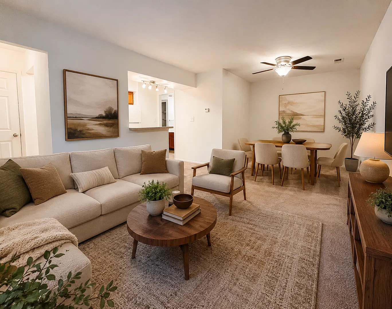Northview Apartments - Inviting open-concept living room and dining area with neutral tones, cozy seating, and tasteful decor.