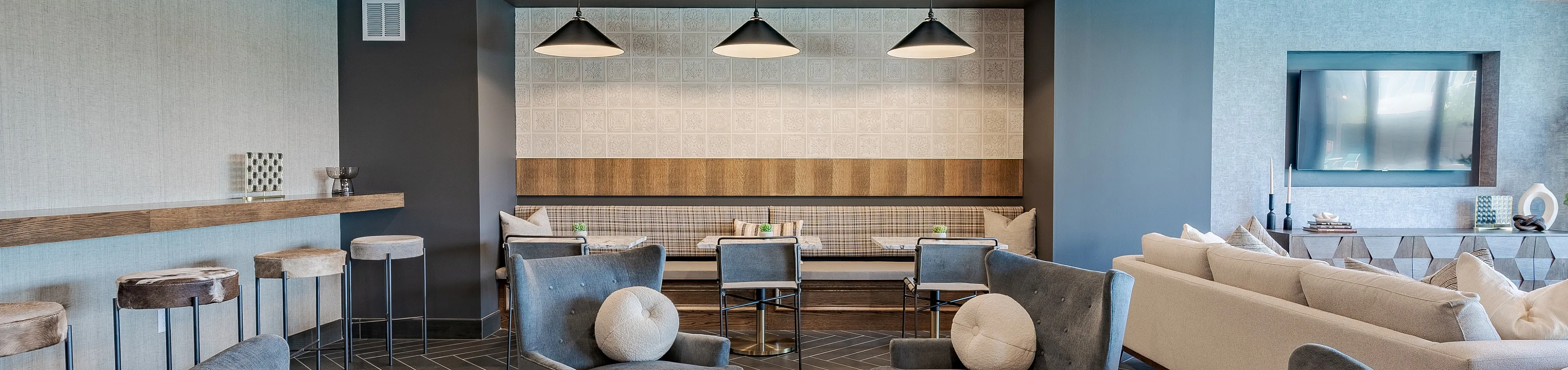 Federal Hill Elegant communal space featuring plush seating, modern lighting, and stylish decor, perfect for gatherings and relaxation.