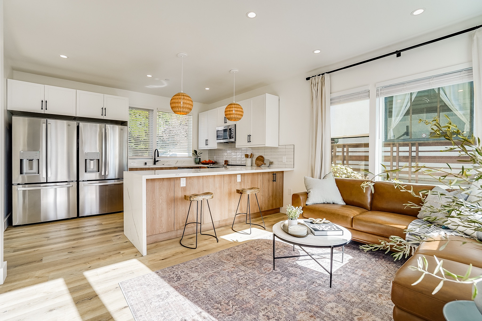 Spacious living room and kitchen with natural light