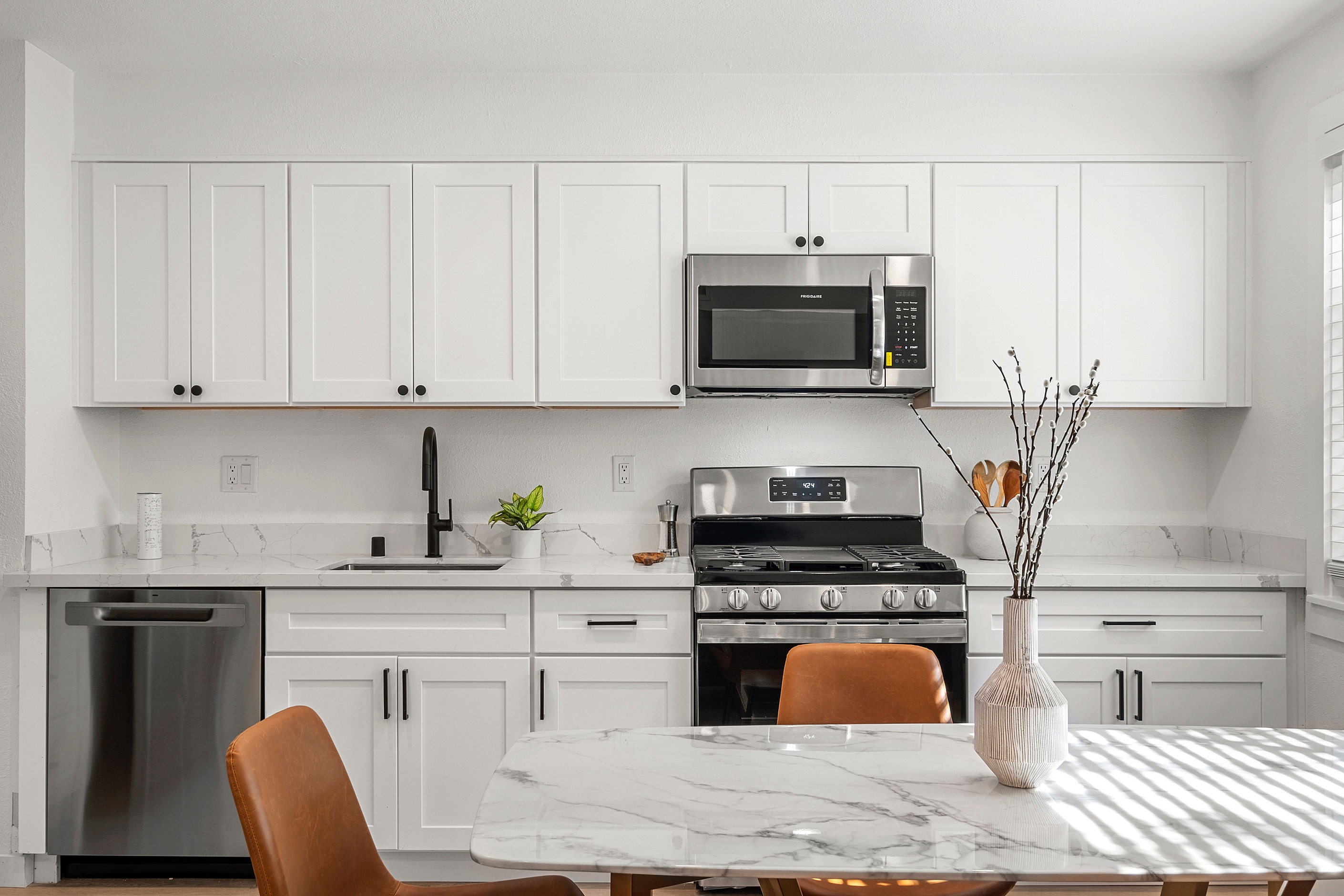 Open concept kitchen with sleek appliances