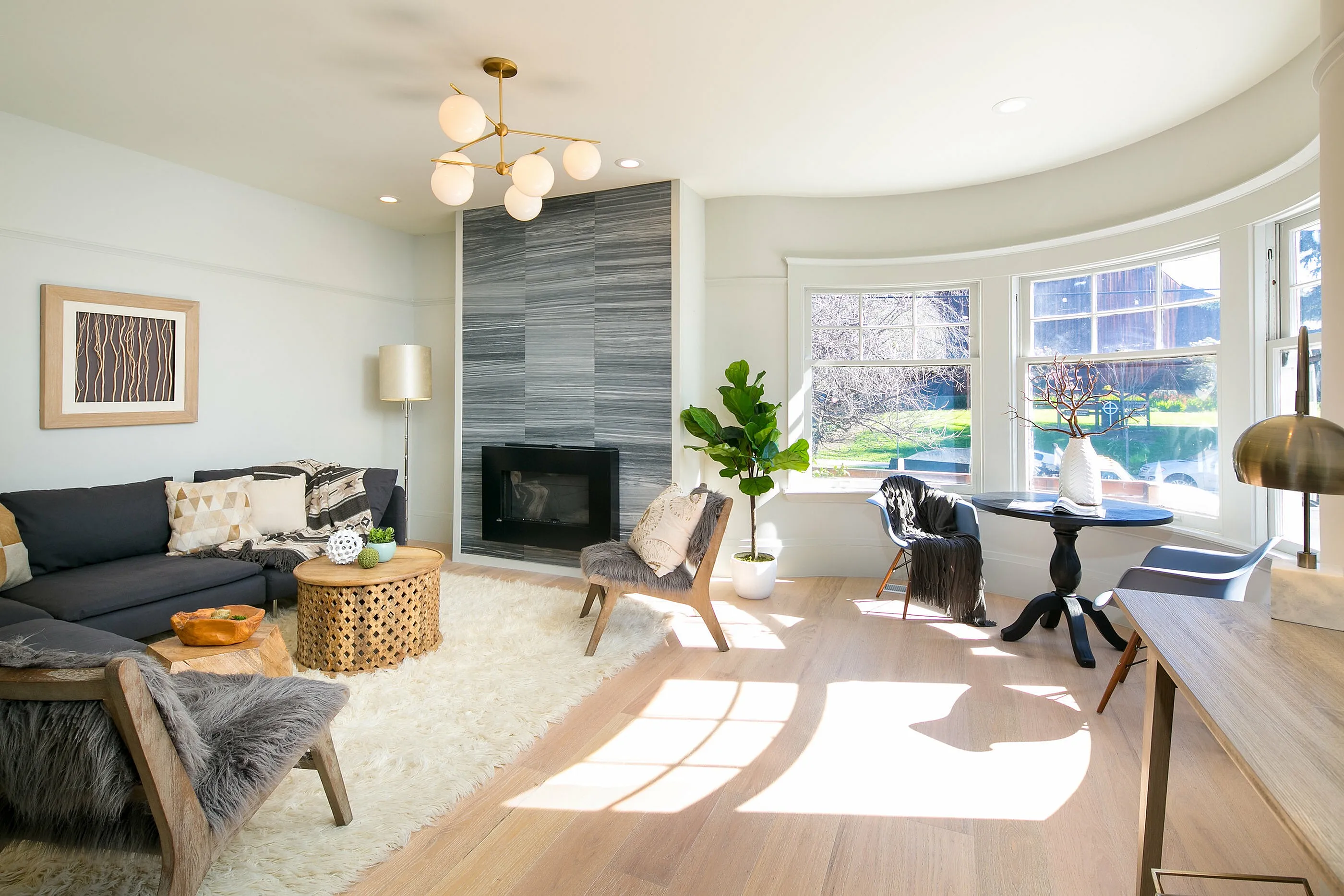 Bright, modern living area with bay windows