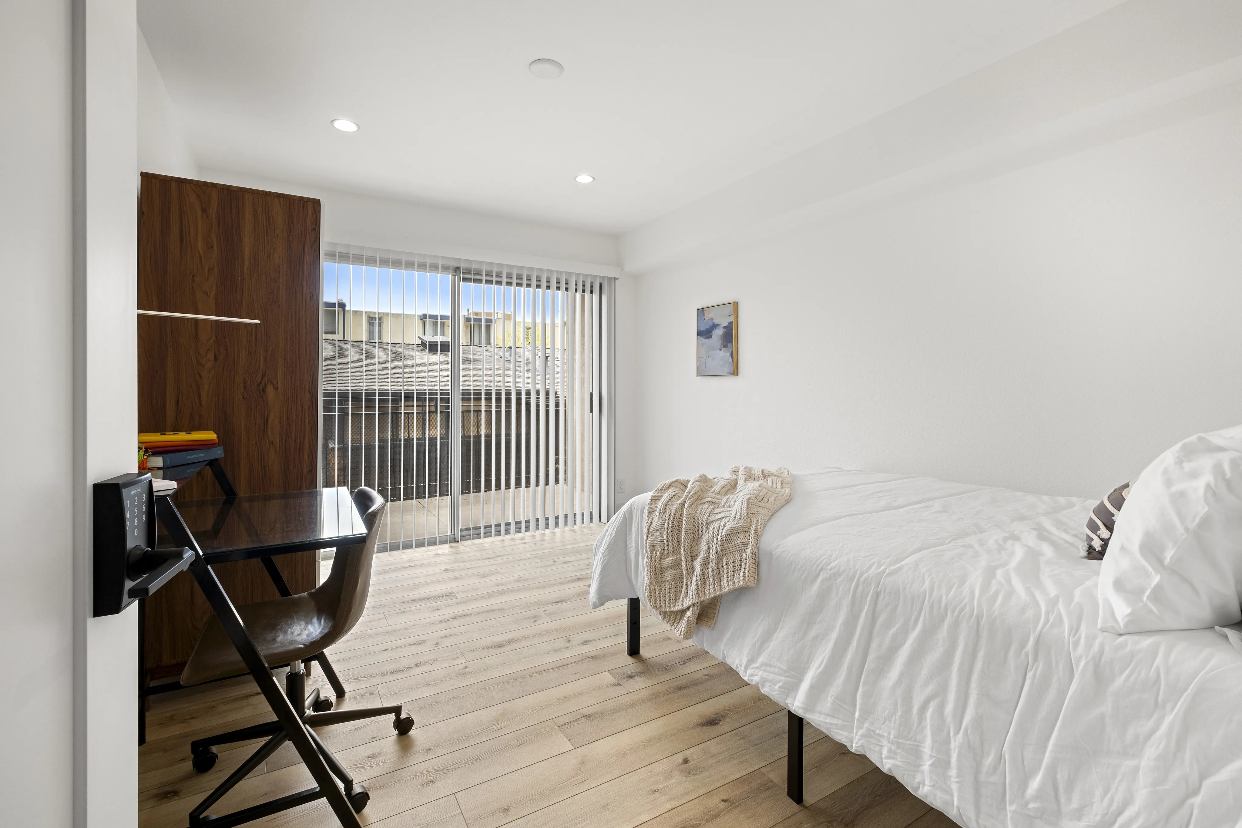 Spacious bedroom featuring a large balcony
