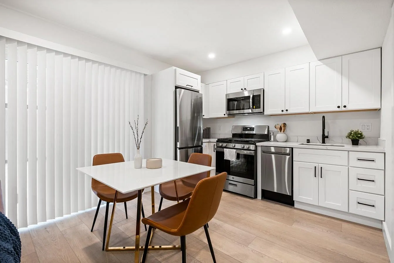 Modern kitchen with stainless steel appliances, clean lines, and a sleek, contemporary design.