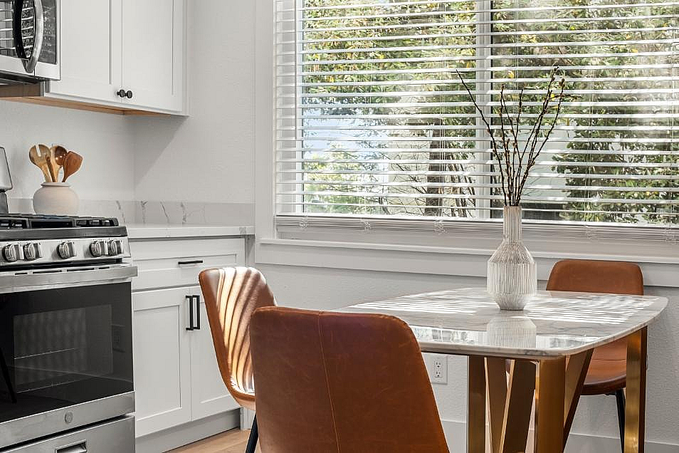 Kitchen and dining area with modern finishes, stainless steel appliances, and a seamless flow between cooking and dining spaces.