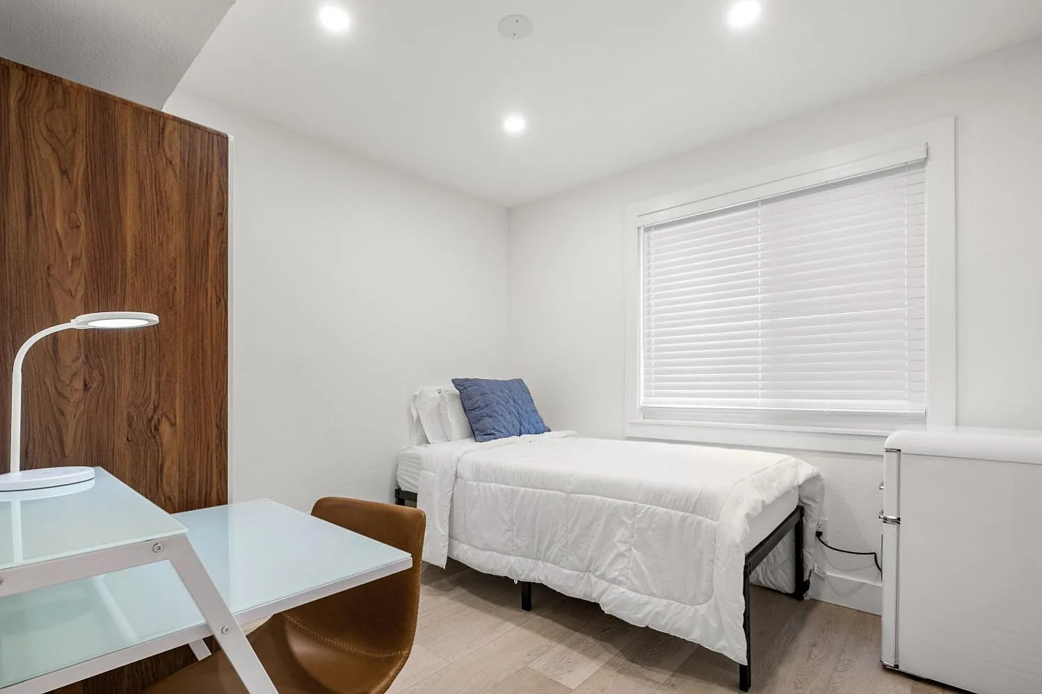 Bedroom with a spacious layout, soft lighting, and a calm, inviting atmosphere.