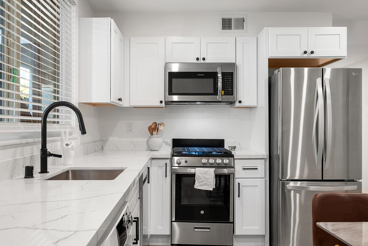 Modern kitchen with stainless steel appliances, clean lines, and a sleek, contemporary design.