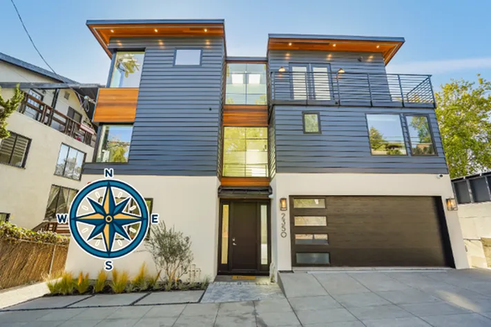 Contemporary three-story home with sleek modern design, large windows, and inviting curb appeal.