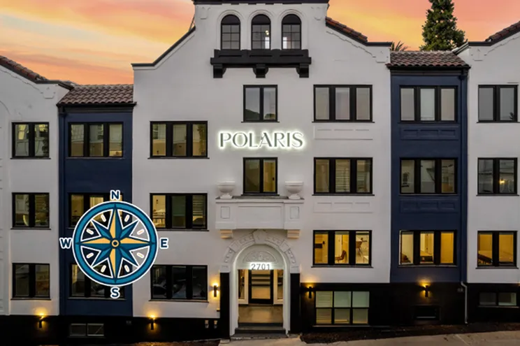 Elegant facade of Polaris apartment building at sunset with classic architecture and inviting entrance.