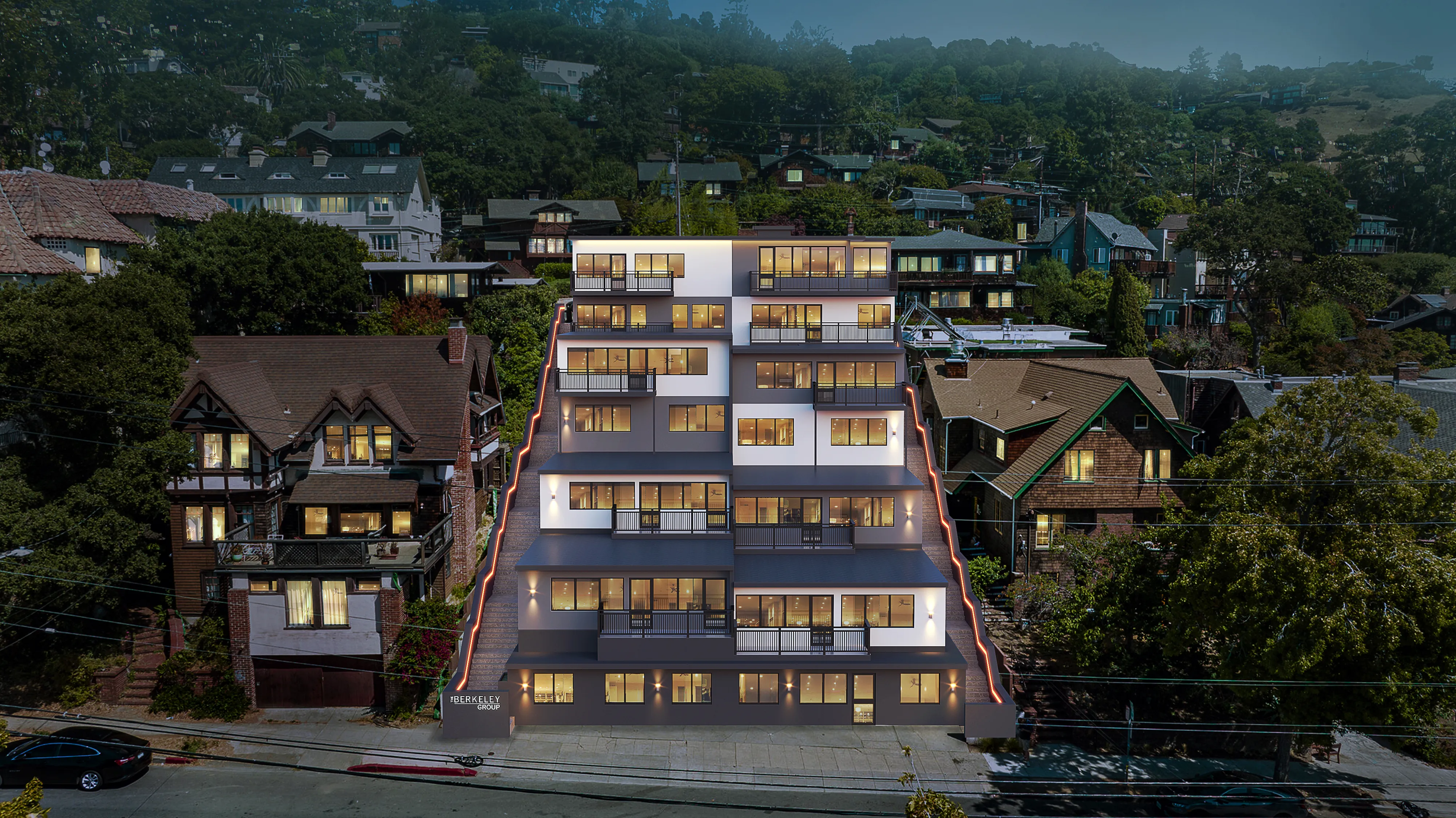 Modern apartment building with illuminated windows nestled in a lush, green neighborhood with a mix of traditional and contemporary architecture.