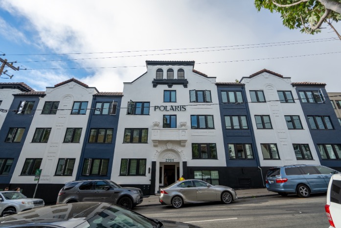 Charming historic building exterior with elegant architectural details and modern finishes, ideal urban living setting.