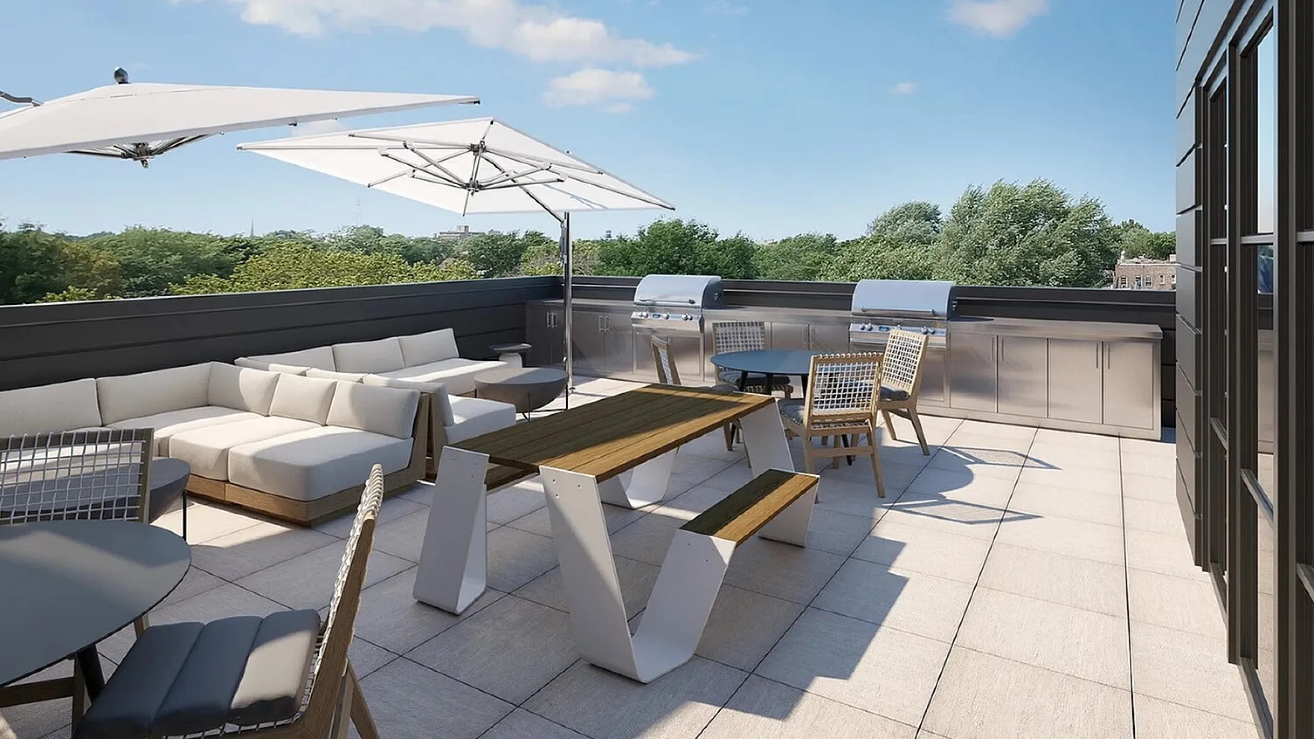 Luxurious rooftop terrace with stylish seating, dining area, and modern grills, offering a perfect blend of relaxation and entertainment with scenic views.