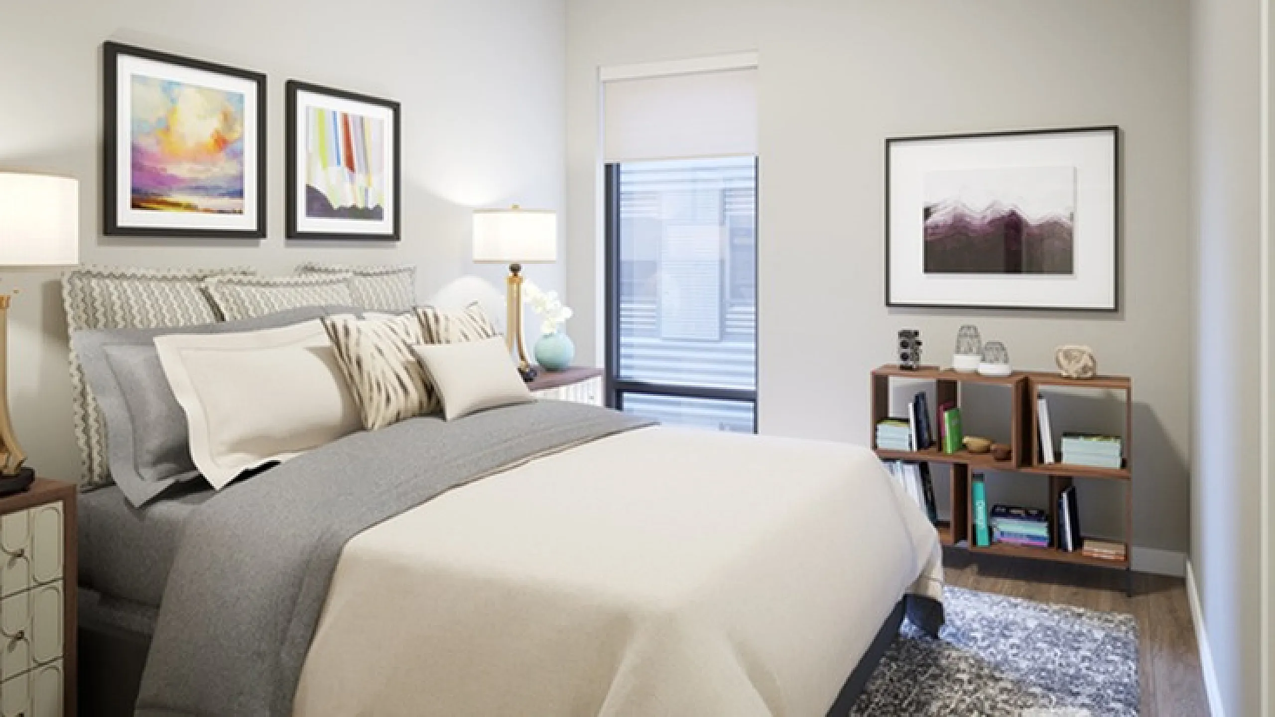 Elegant bedroom with modern decor, featuring a large comfortable bed, stylish artwork, and ample natural light from a shaded window.