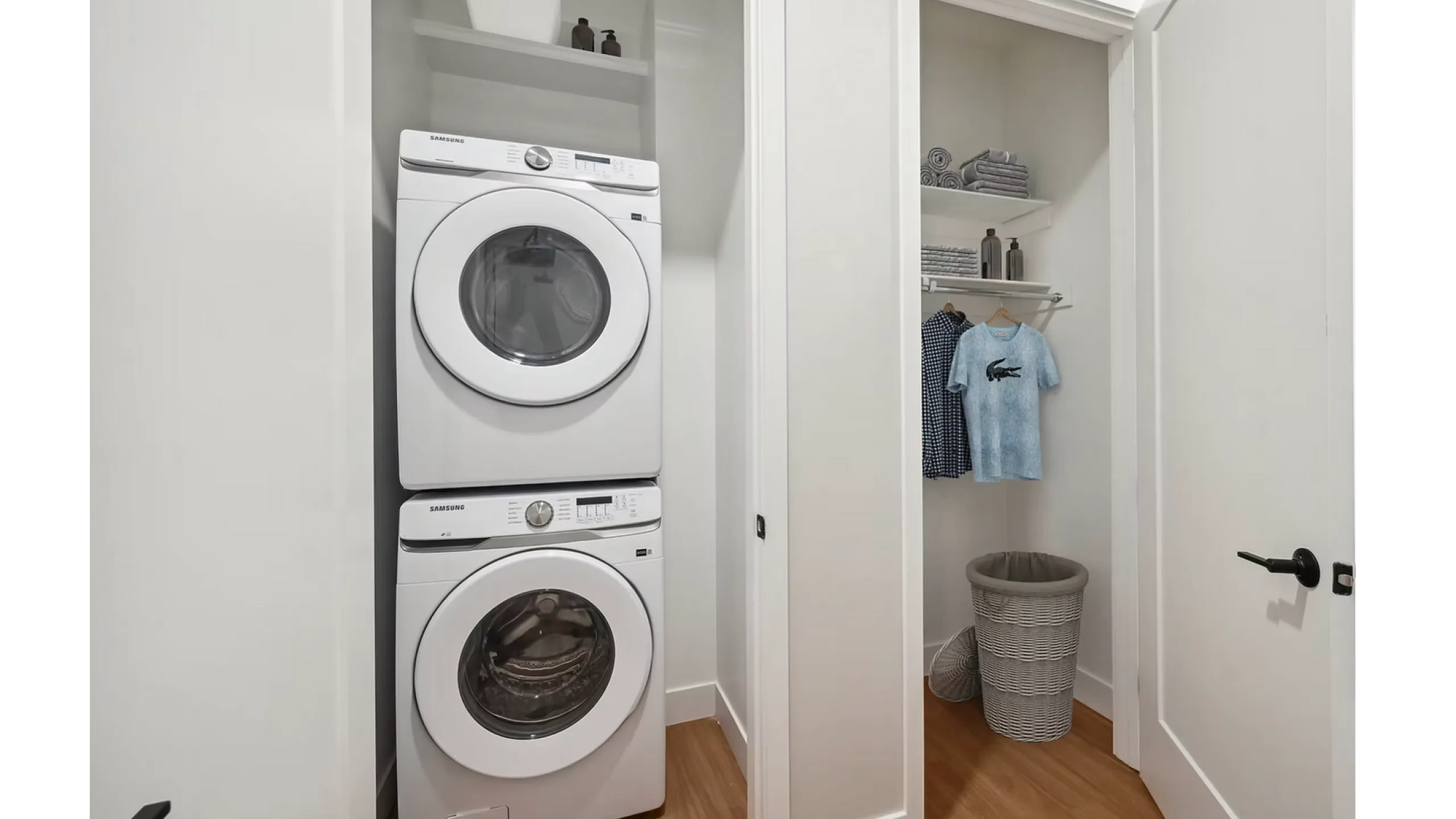 Modern laundry area with stacked washer and dryer adjacent to a neat closet space. Features sleek design, organized shelving, and stylish wooden flooring, perfect for convenient urban living.