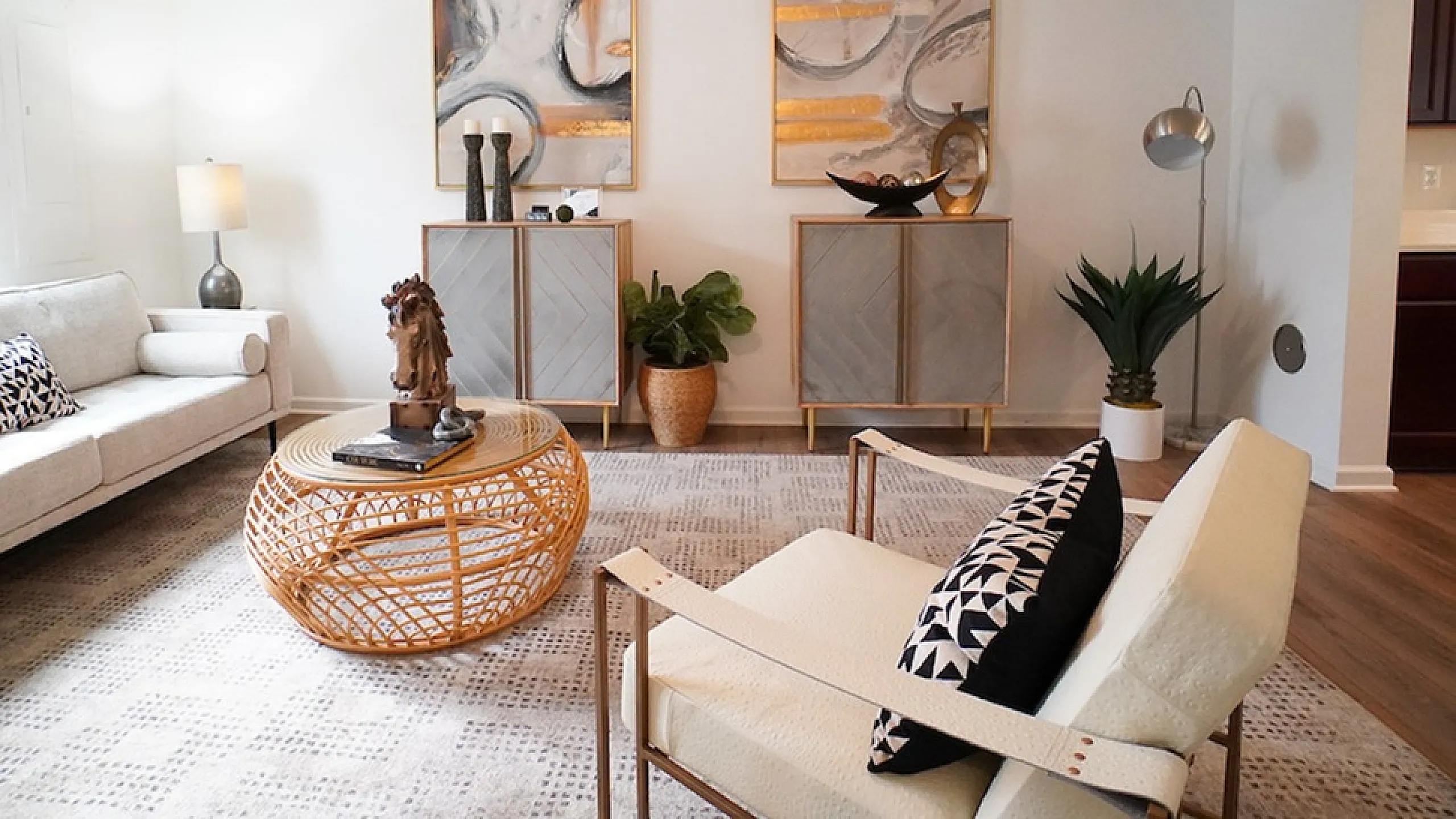 Charming living room with cozy seating, artistic decor, and natural lighting, perfect for relaxation and style.