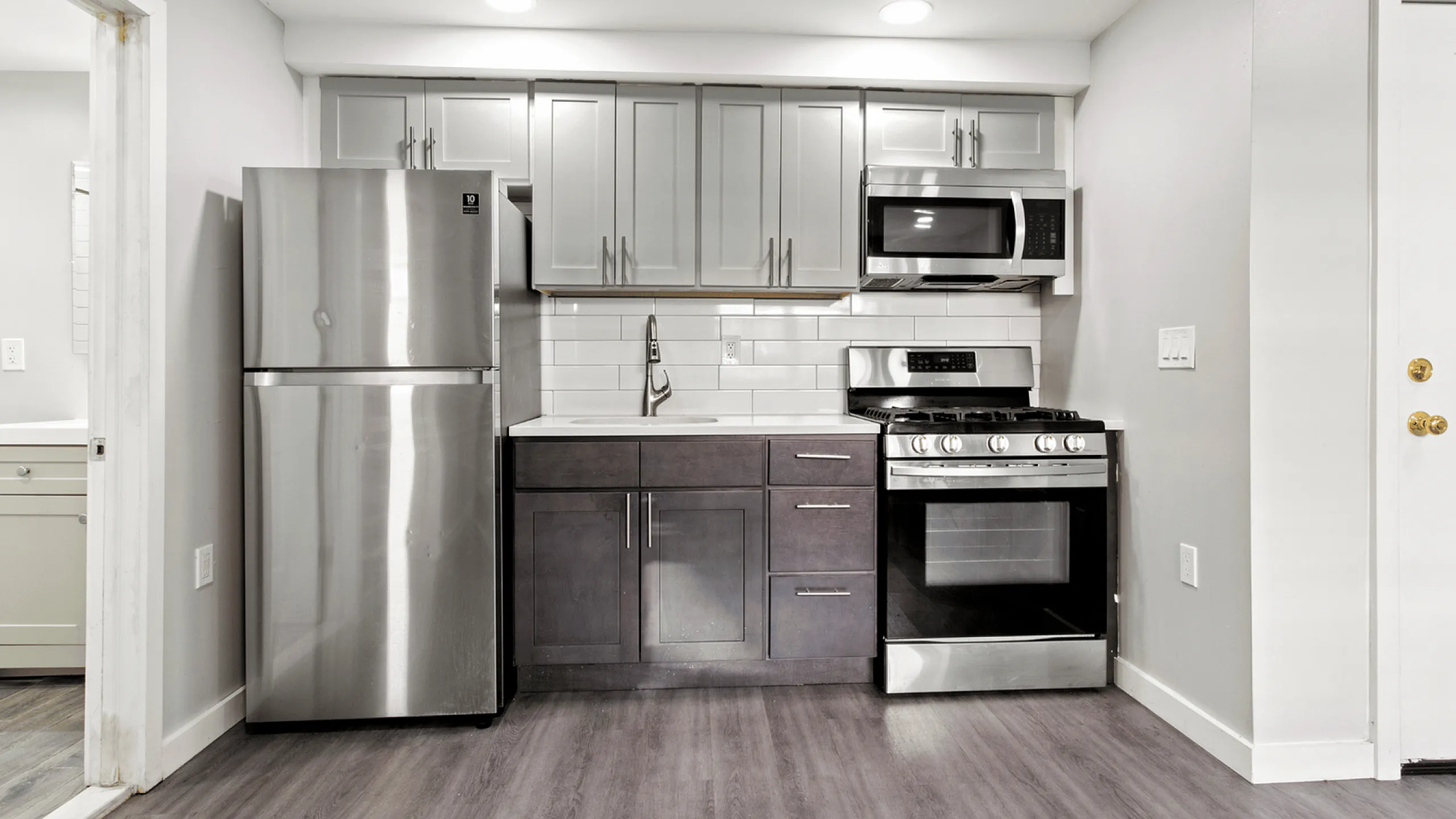Contemporary kitchen with stainless steel appliances and stylish cabinetry.