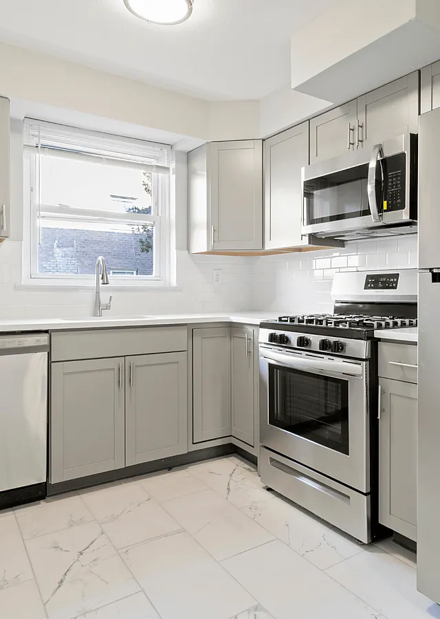 Sleek modern kitchen with stainless steel appliances and minimalist cabinetry.