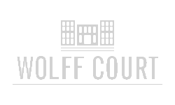 Elegant logo of Wolff Court featuring a symmetrical building icon.