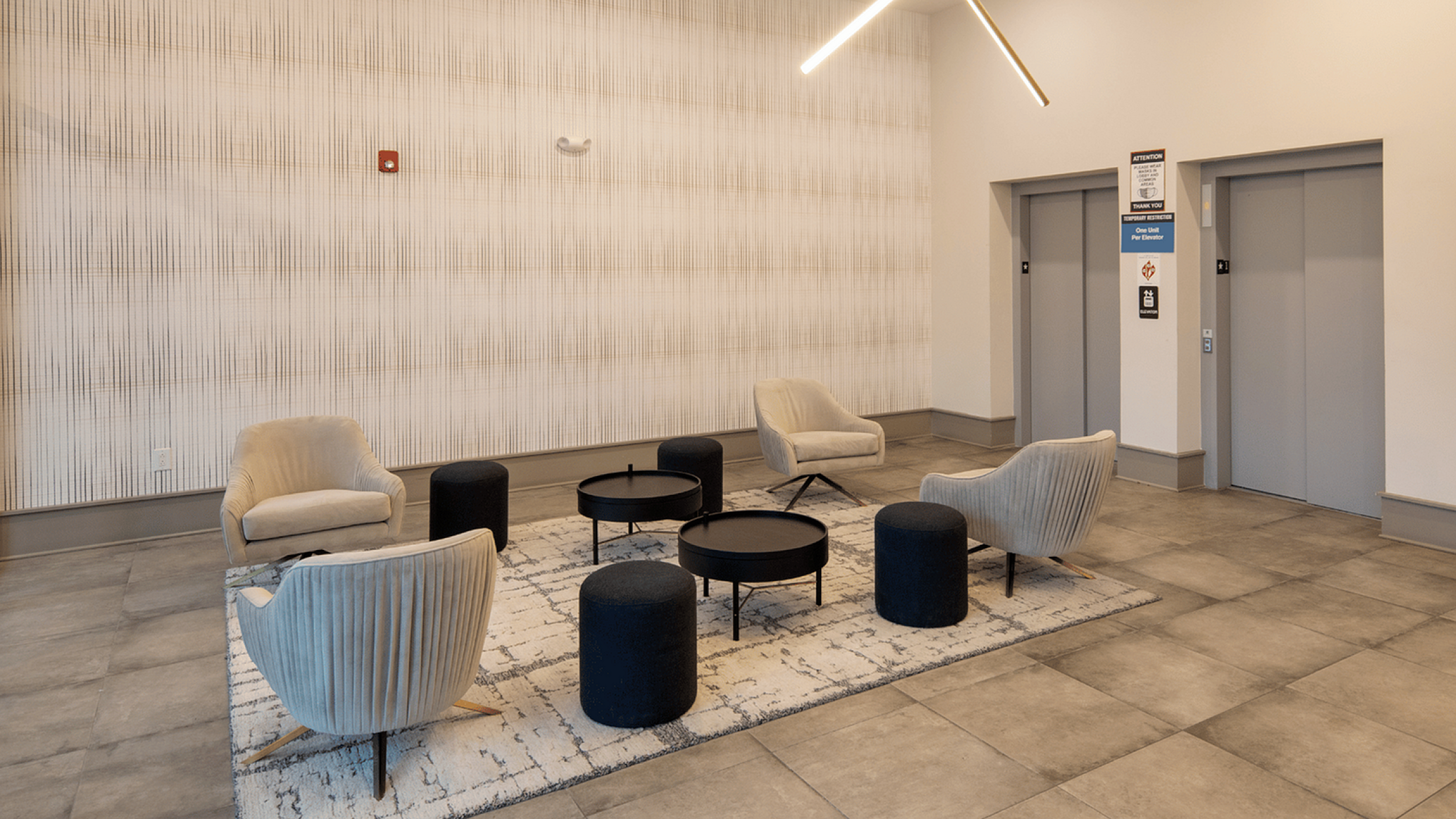 Sophisticated lobby with modern seating and elegant lighting fixtures.