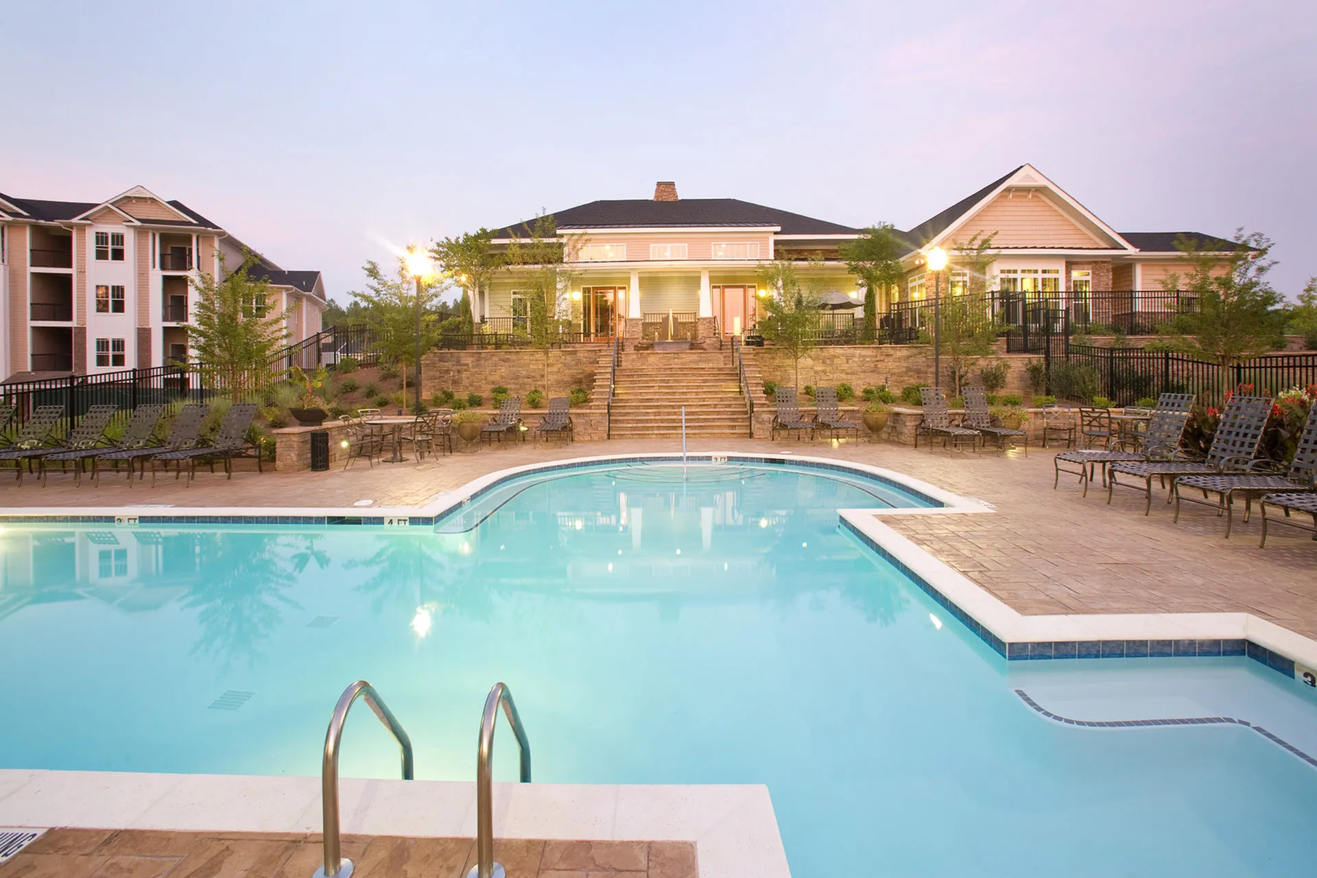 Swimming pool with in water seating at Abberly Place Apartments in Garner, NC