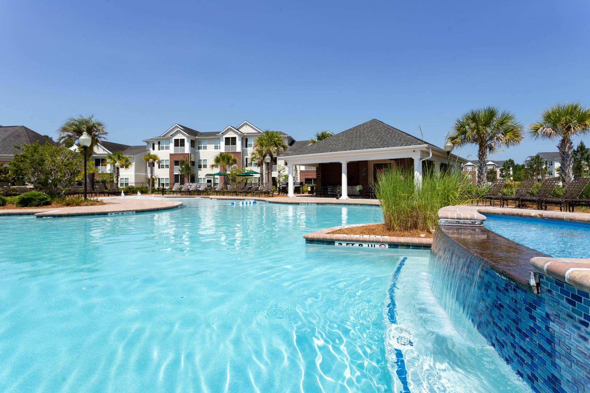 Glimmering Pool with Water Featureat Abberly Chase Apartments in Ridgeland, SC