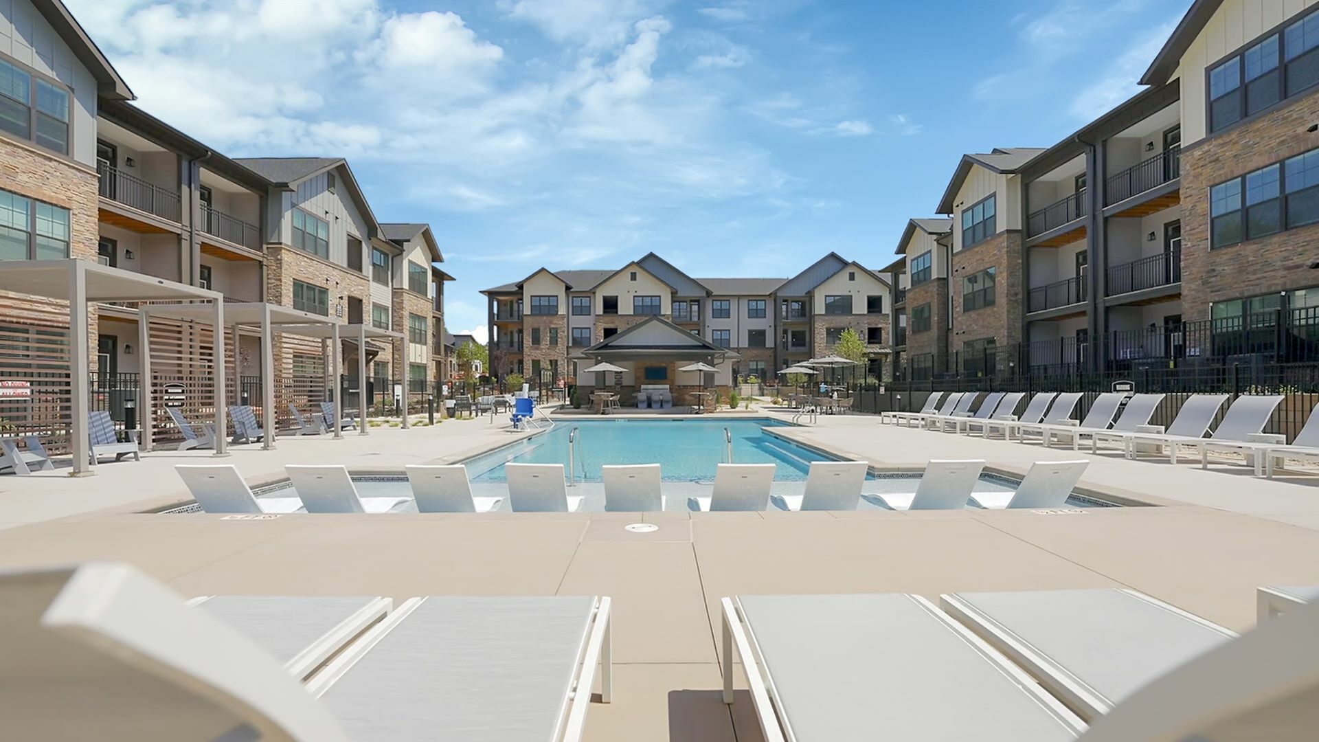 Sparkling Pool with Lounge Chairs at Abberly Commons Apartments in Charlotte, NC