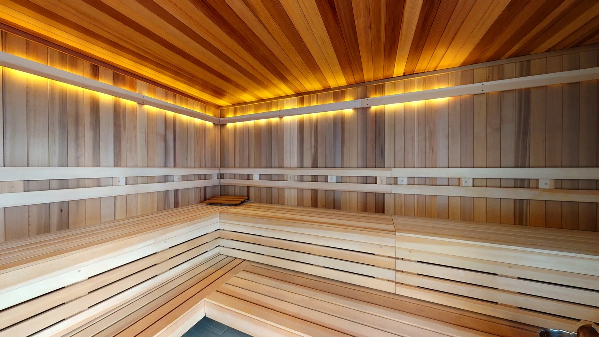 Luxurious wooden sauna with soft ambient lighting, perfect for relaxation and rejuvenation.