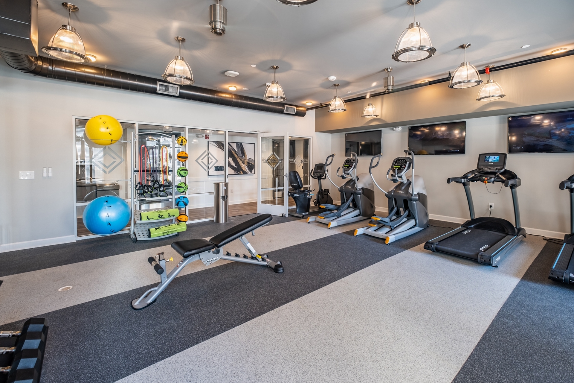 Modern fitness center with state-of-the-art exercise equipment, sleek design, and vibrant workout accessories.