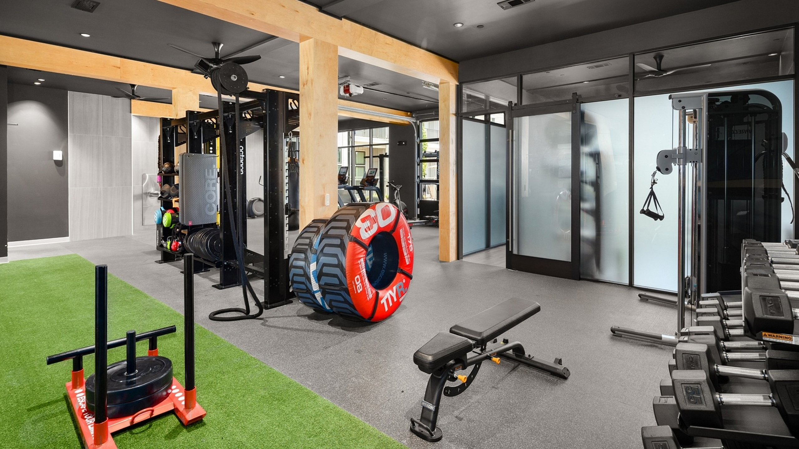 A gym featuring equipment and weights at Abberly Alston Apartment Homes and Townhomes in Cary, NC