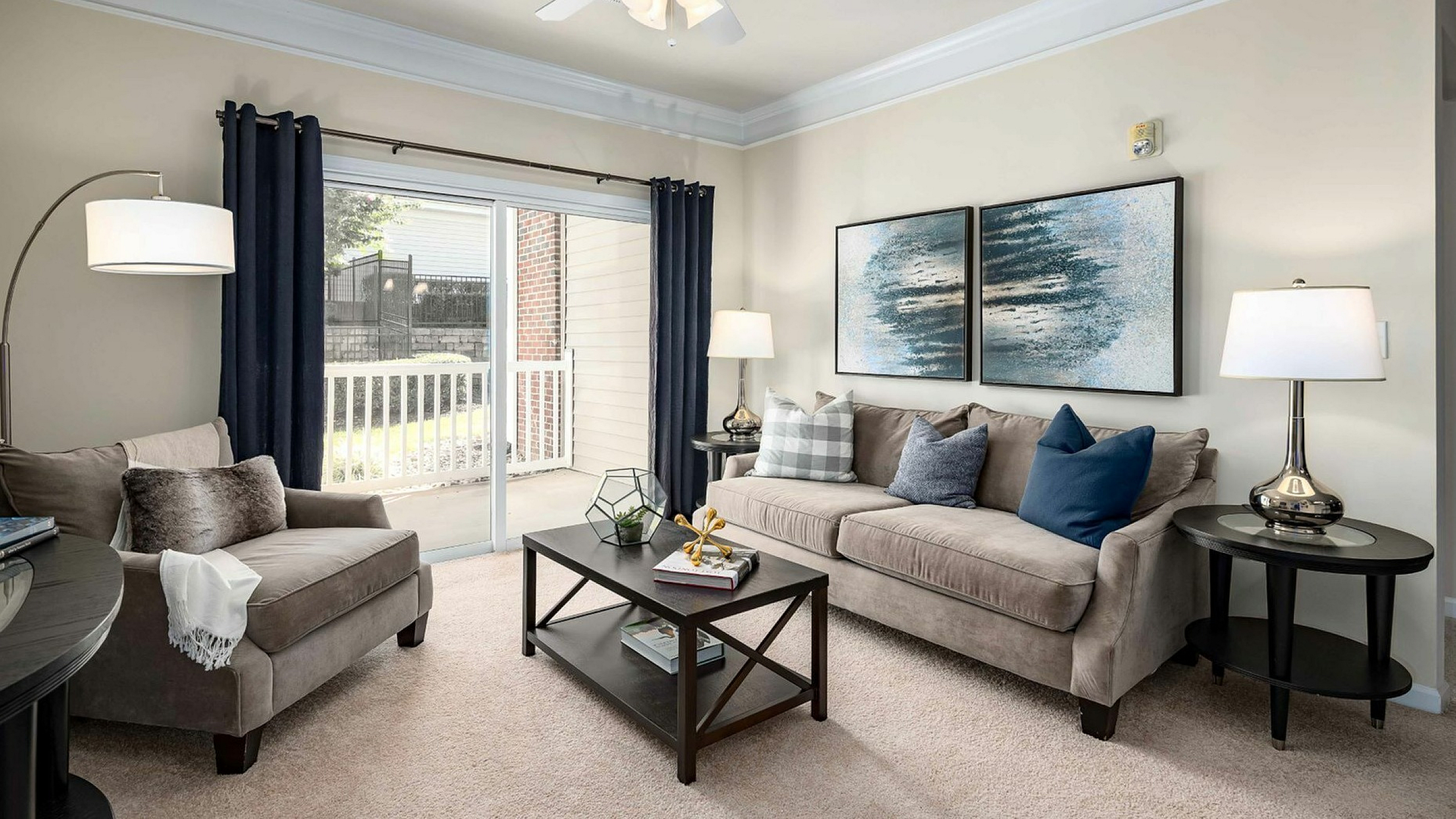 Living Room with Balcony at Abberly Green Apartments in Mooresville, NC