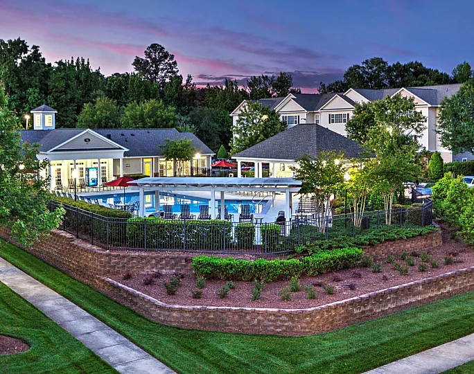 Beautifully landscaped pool area at Abberly Grove Apartments in Raleigh, NC