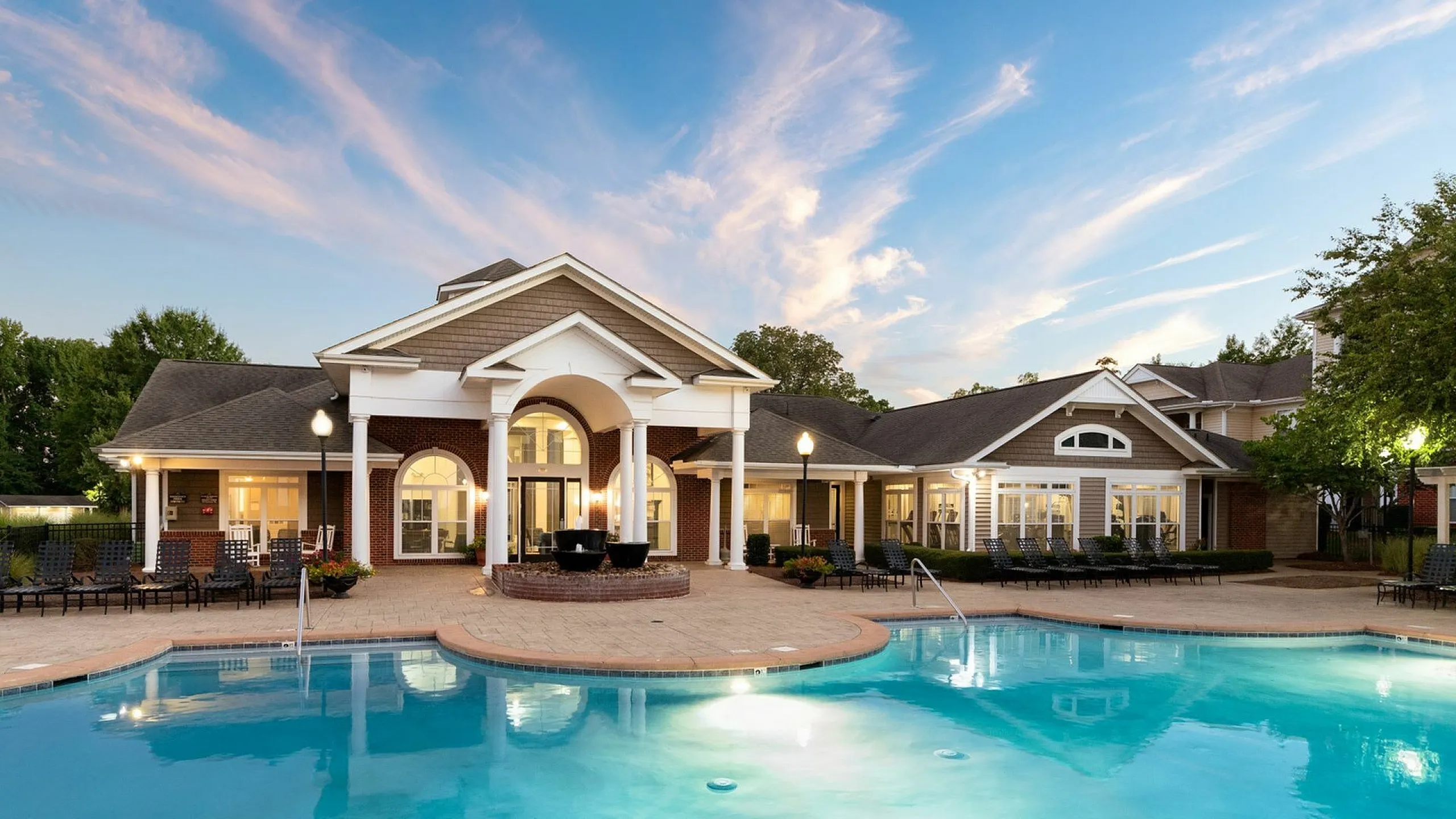 Exterior View of Pool and Clubhouse at Abberly Woods Apartments in Charlotte, NC