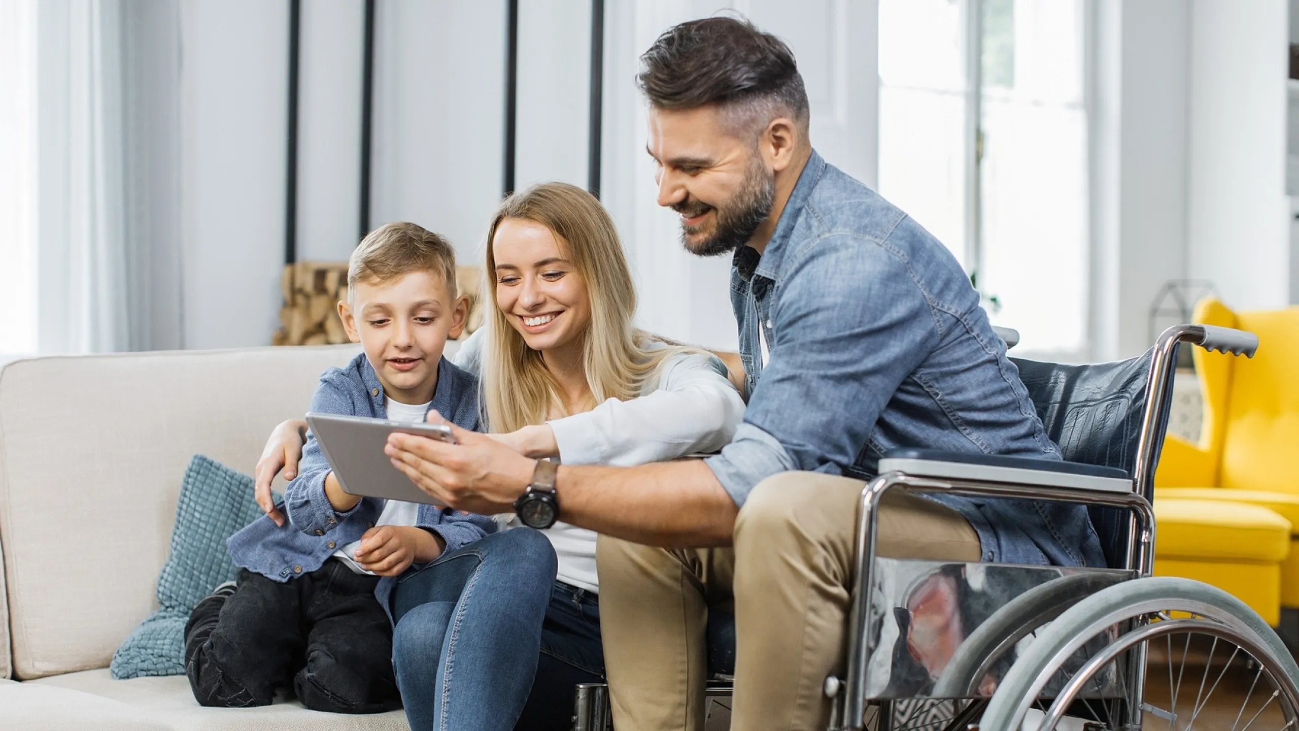Happy family enjoying quality time together in a bright, modern living room.