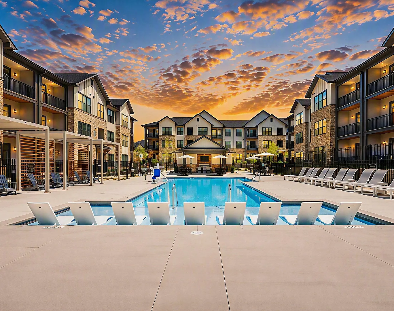 Luxurious apartment complex with a sparkling pool and sunset views, perfect for relaxing and enjoying modern amenities.
