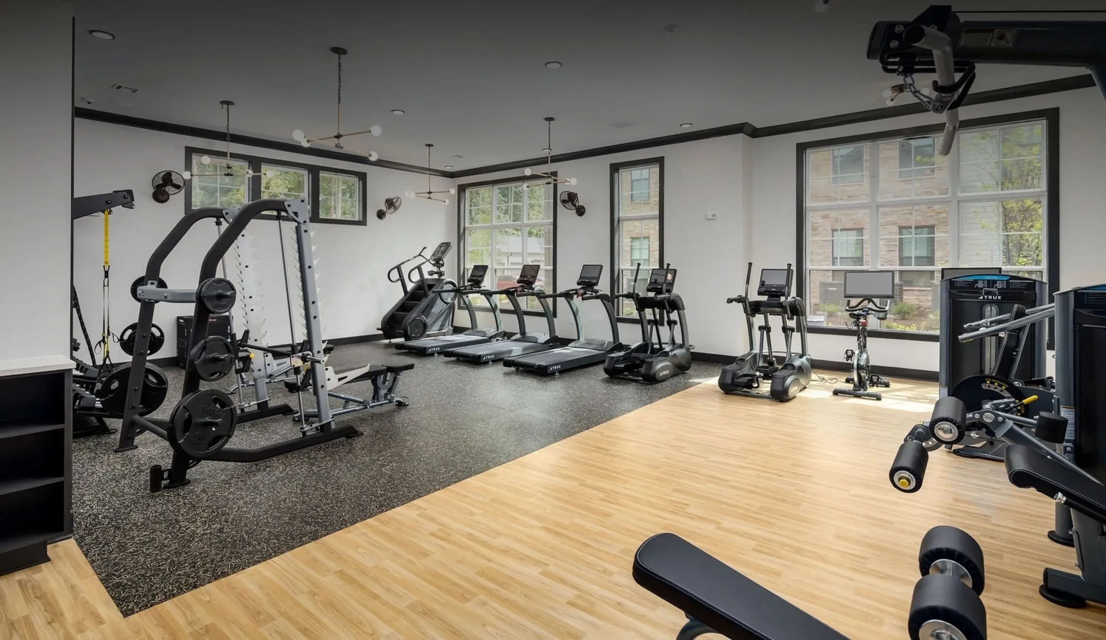 Fitness center with cardio and strength equipment at Abberly Commons in Charlotte, NC.