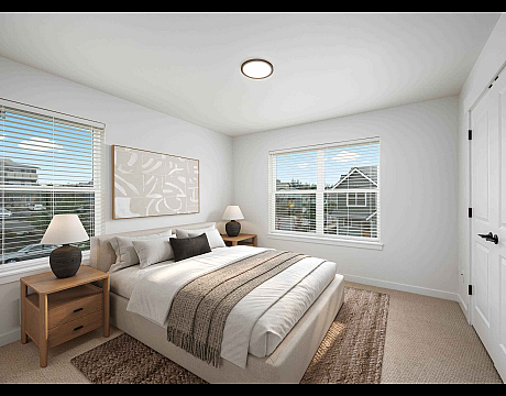 Bright and airy modern bedroom with large windows, cozy bed, and stylish decor.