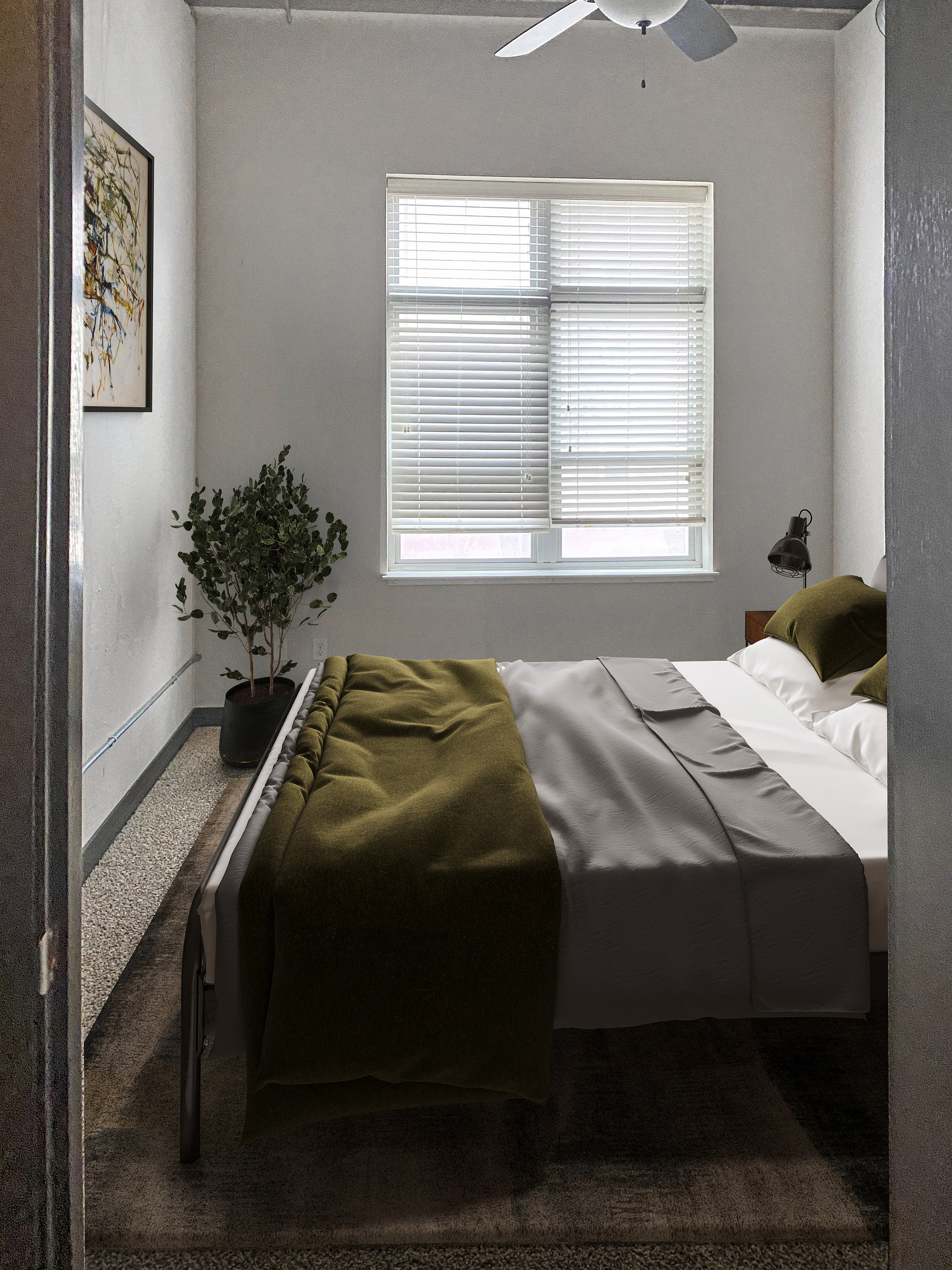 Cozy bedroom with modern decor, featuring a large window with blinds, stylish bed with green bedding, and a vibrant plant adding a touch of nature.