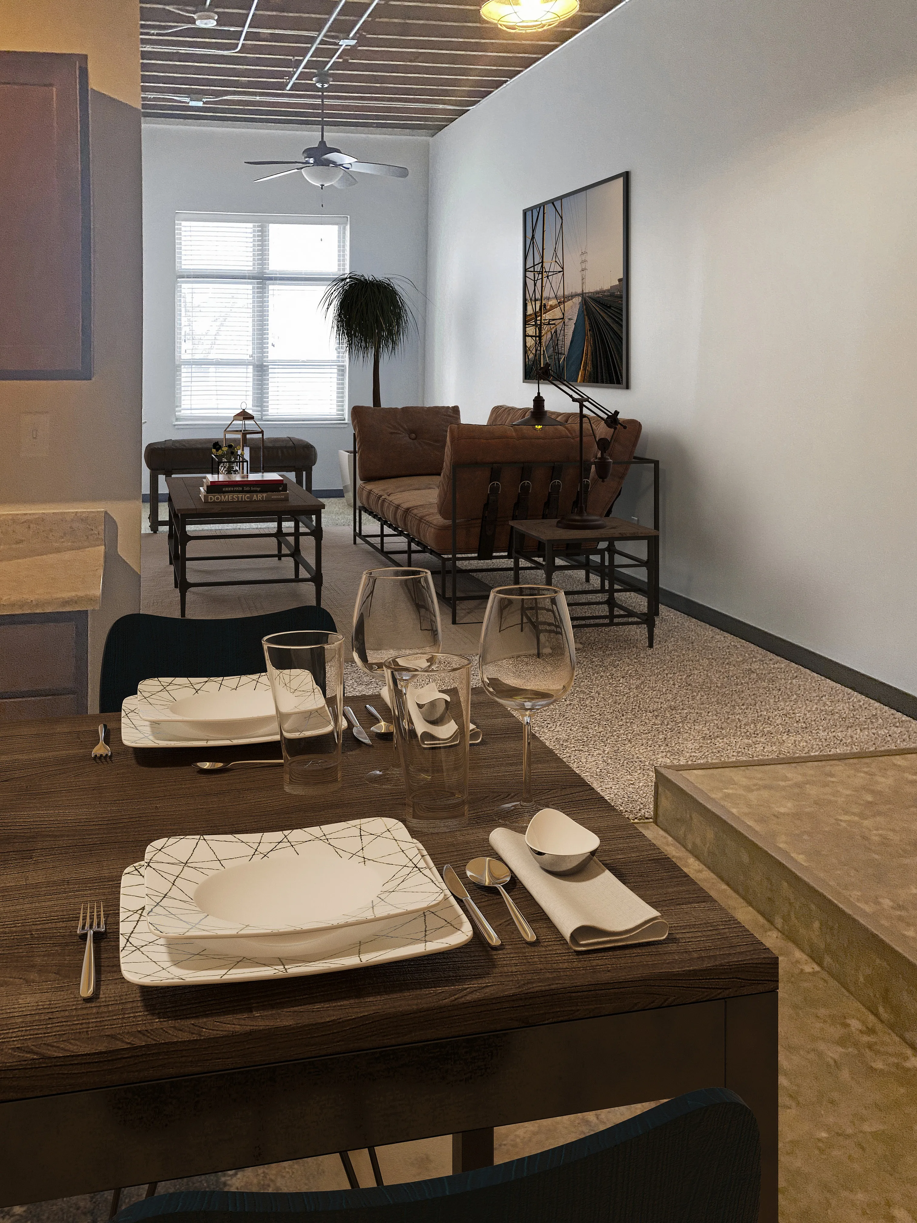 Elegant open-concept living area with stylish dining setup, featuring a cozy seating arrangement and modern decor.