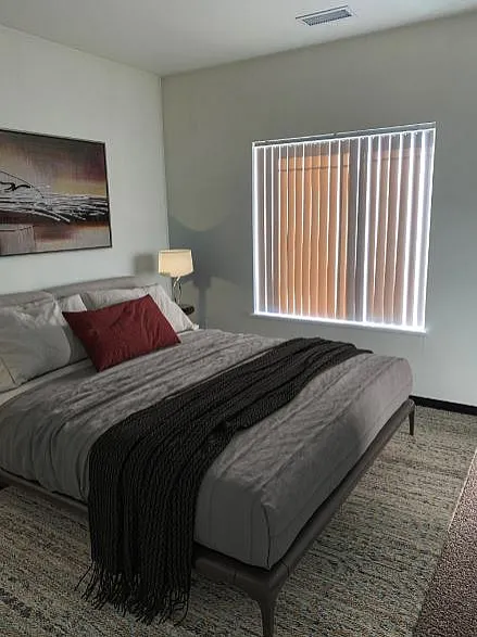 Cozy bedroom with modern decor featuring a plush bed, elegant lighting, and natural light filtering through stylish blinds.