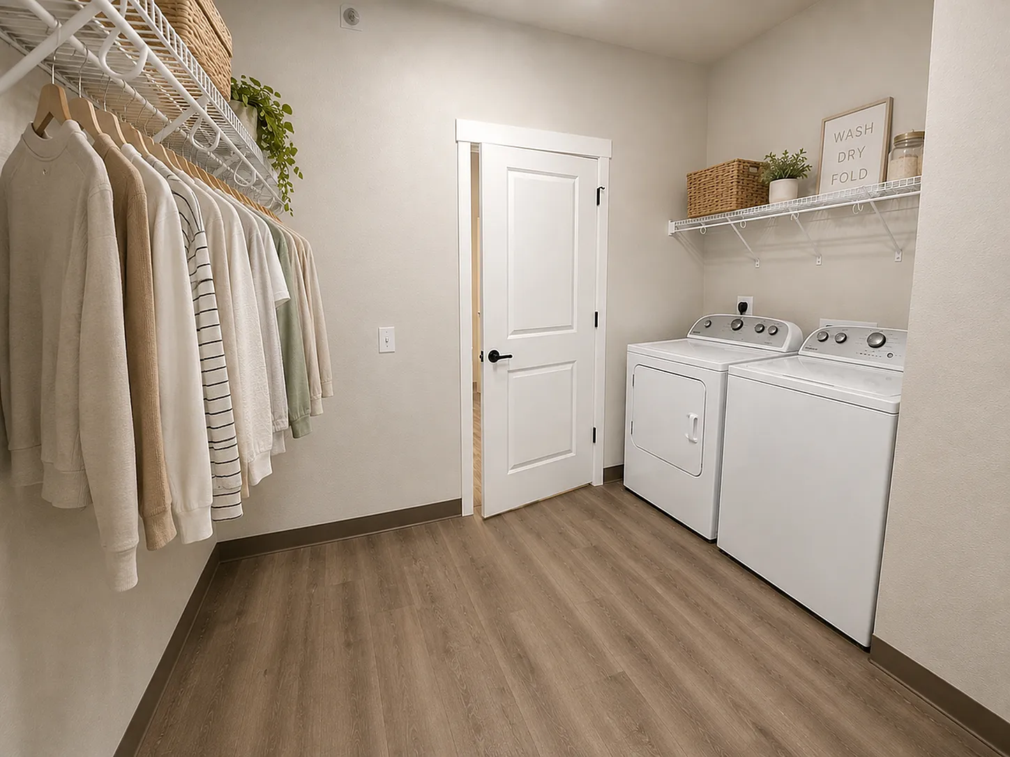 Modern laundry room featuring sleek washer and dryer, stylish shelving, and elegant wood flooring.