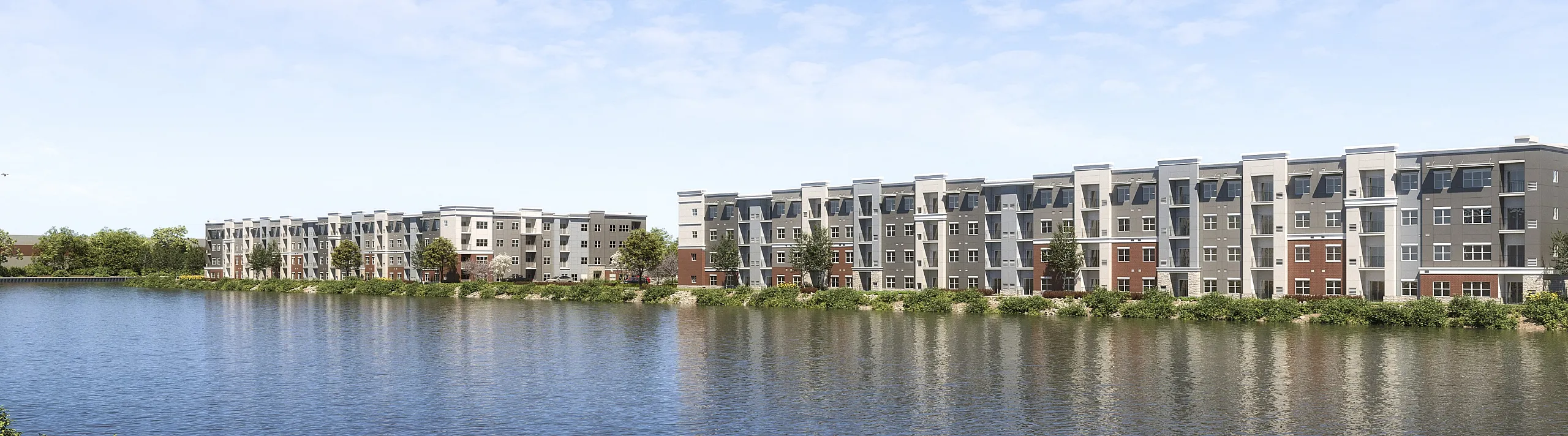 Charming riverside apartment complex with modern architecture, set against a serene sky and lush greenery.